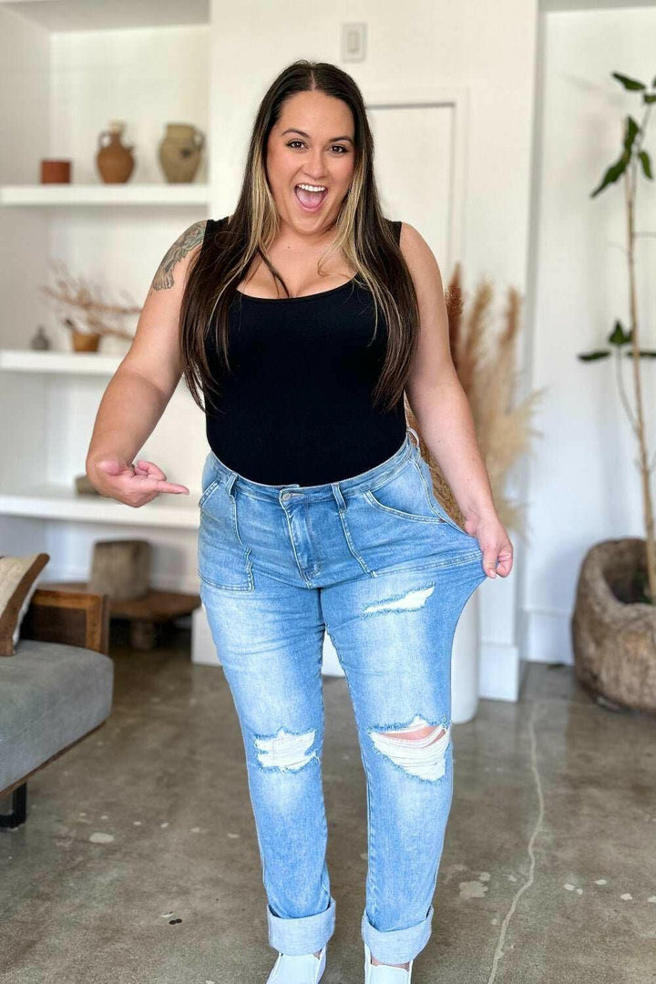 Judy Blue Distressed Straight Leg Jeans with Patch PocketsThese distressed straight jeans feature stylish patch pockets for added flair. The distressed detailing adds a trendy touch to your look. The straight cut offers a fStraight Leg JeansJudy Blue Distressed