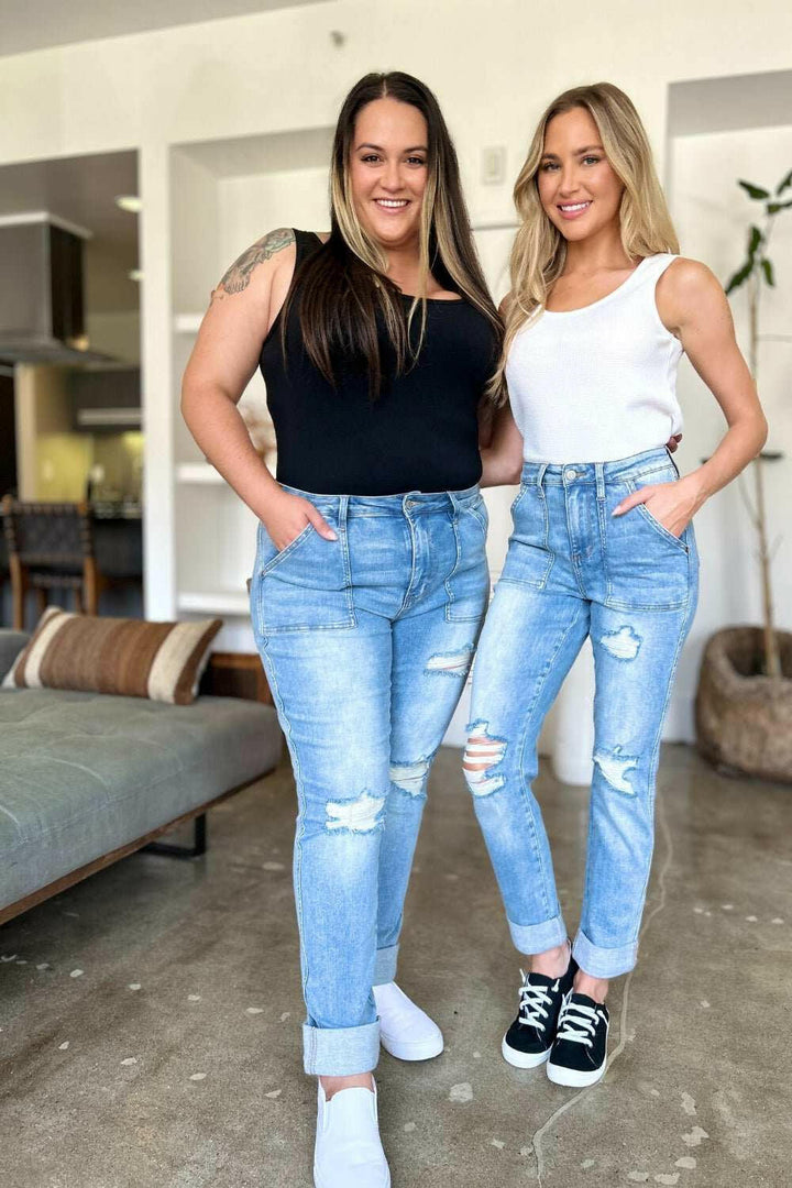 Judy Blue Distressed Straight Leg Jeans with Patch PocketsThese distressed straight jeans feature stylish patch pockets for added flair. The distressed detailing adds a trendy touch to your look. The straight cut offers a fStraight Leg JeansJudy Blue Distressed