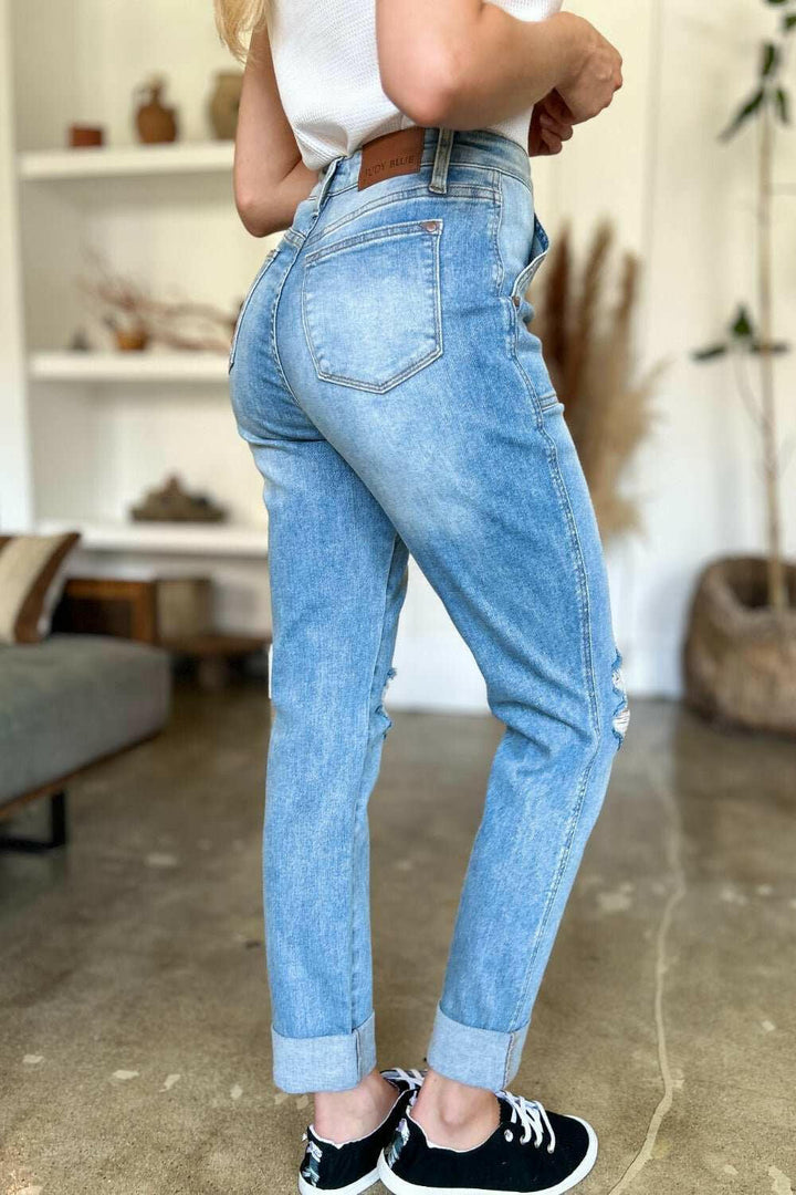 Judy Blue Distressed Straight Leg Jeans with Patch PocketsThese distressed straight jeans feature stylish patch pockets for added flair. The distressed detailing adds a trendy touch to your look. The straight cut offers a fStraight Leg JeansJudy Blue Distressed