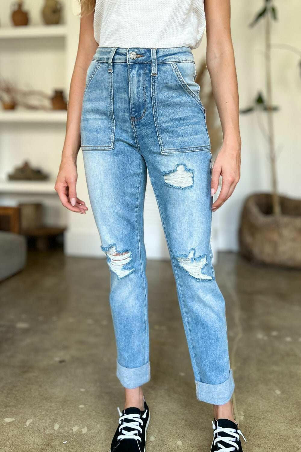 Judy Blue Distressed Straight Leg Jeans with Patch PocketsThese distressed straight jeans feature stylish patch pockets for added flair. The distressed detailing adds a trendy touch to your look. The straight cut offers a fStraight Leg JeansJudy Blue Distressed