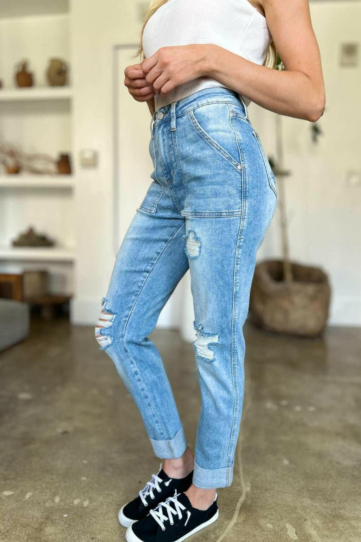 Judy Blue Distressed Straight Leg Jeans with Patch PocketsThese distressed straight jeans feature stylish patch pockets for added flair. The distressed detailing adds a trendy touch to your look. The straight cut offers a fStraight Leg JeansJudy Blue Distressed