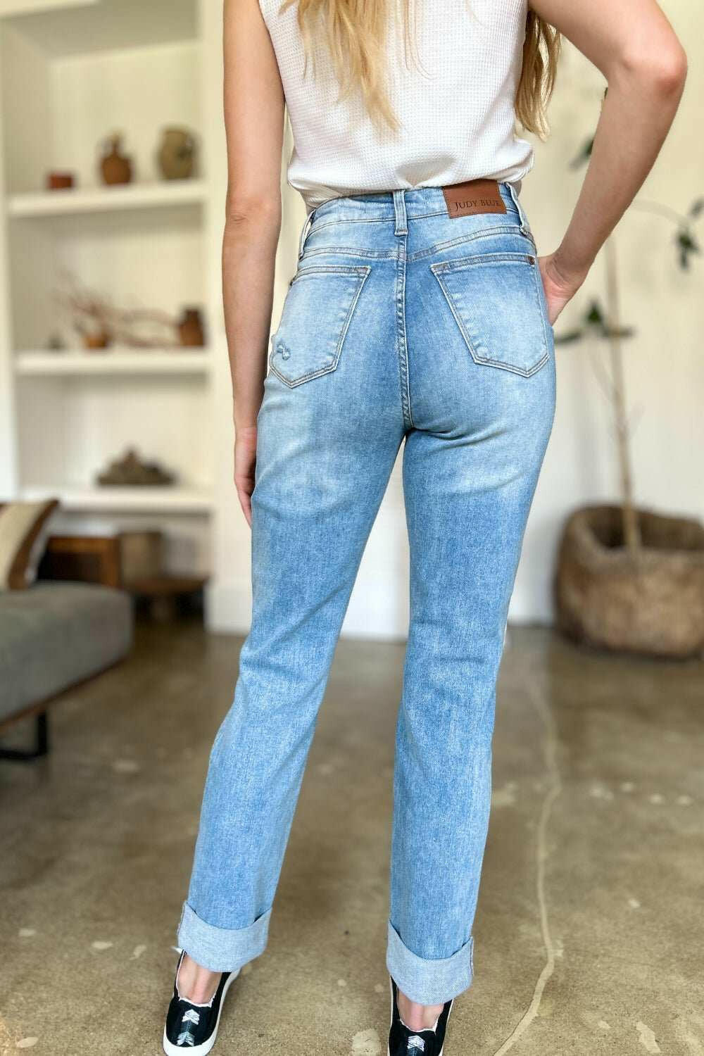 Judy Blue Distressed Straight Leg Jeans with Patch PocketsThese distressed straight jeans feature stylish patch pockets for added flair. The distressed detailing adds a trendy touch to your look. The straight cut offers a fStraight Leg JeansJudy Blue Distressed