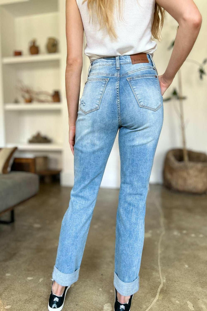 Judy Blue Distressed Straight Leg Jeans with Patch PocketsThese distressed straight jeans feature stylish patch pockets for added flair. The distressed detailing adds a trendy touch to your look. The straight cut offers a fStraight Leg JeansJudy Blue Distressed