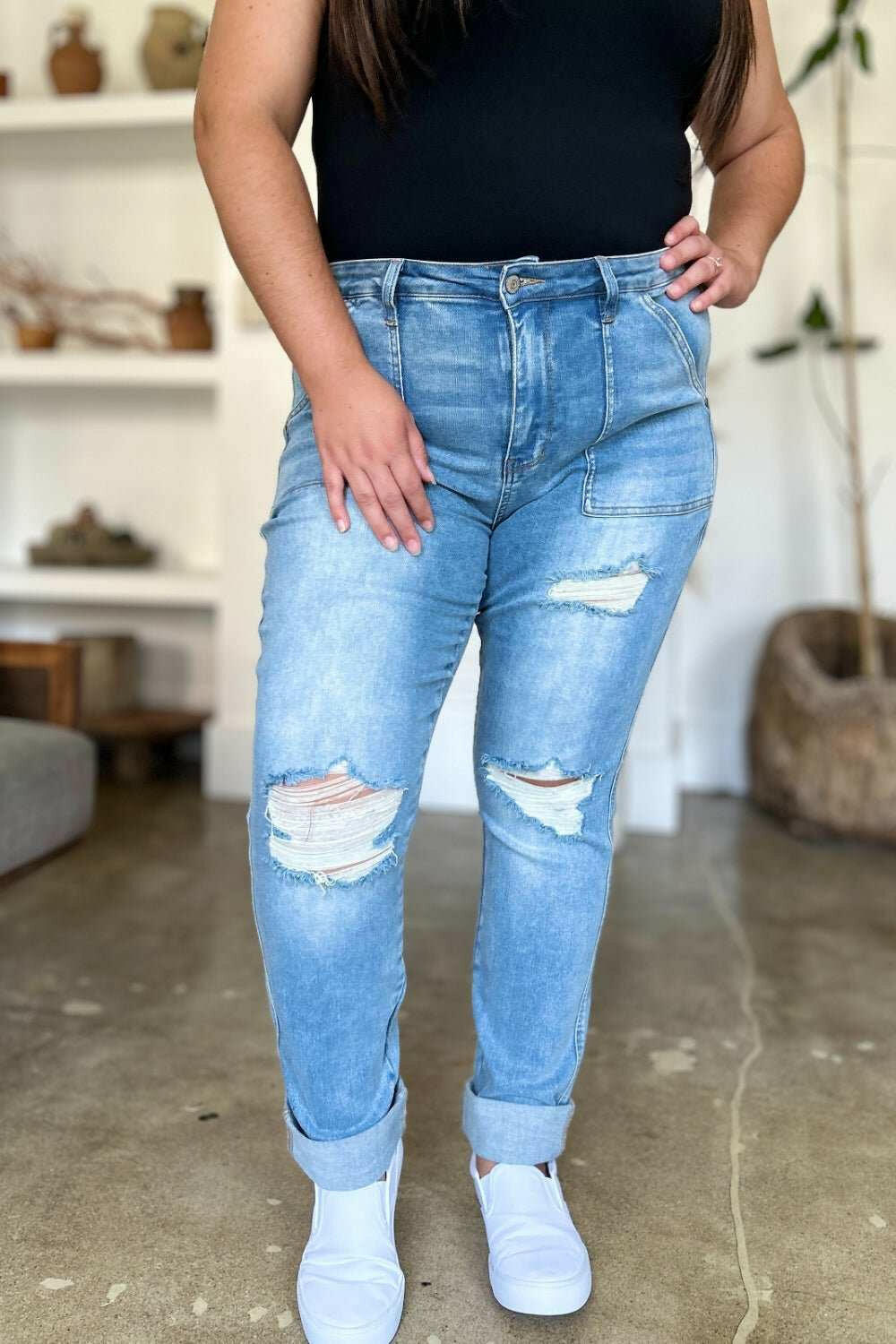 Judy Blue Distressed Straight Leg Jeans with Patch PocketsThese distressed straight jeans feature stylish patch pockets for added flair. The distressed detailing adds a trendy touch to your look. The straight cut offers a fStraight Leg JeansJudy Blue Distressed