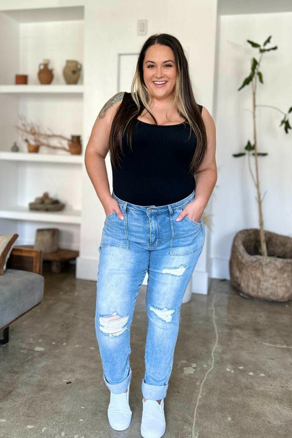 Judy Blue Distressed Straight Leg Jeans with Patch PocketsThese distressed straight jeans feature stylish patch pockets for added flair. The distressed detailing adds a trendy touch to your look. The straight cut offers a fStraight Leg JeansJudy Blue Distressed