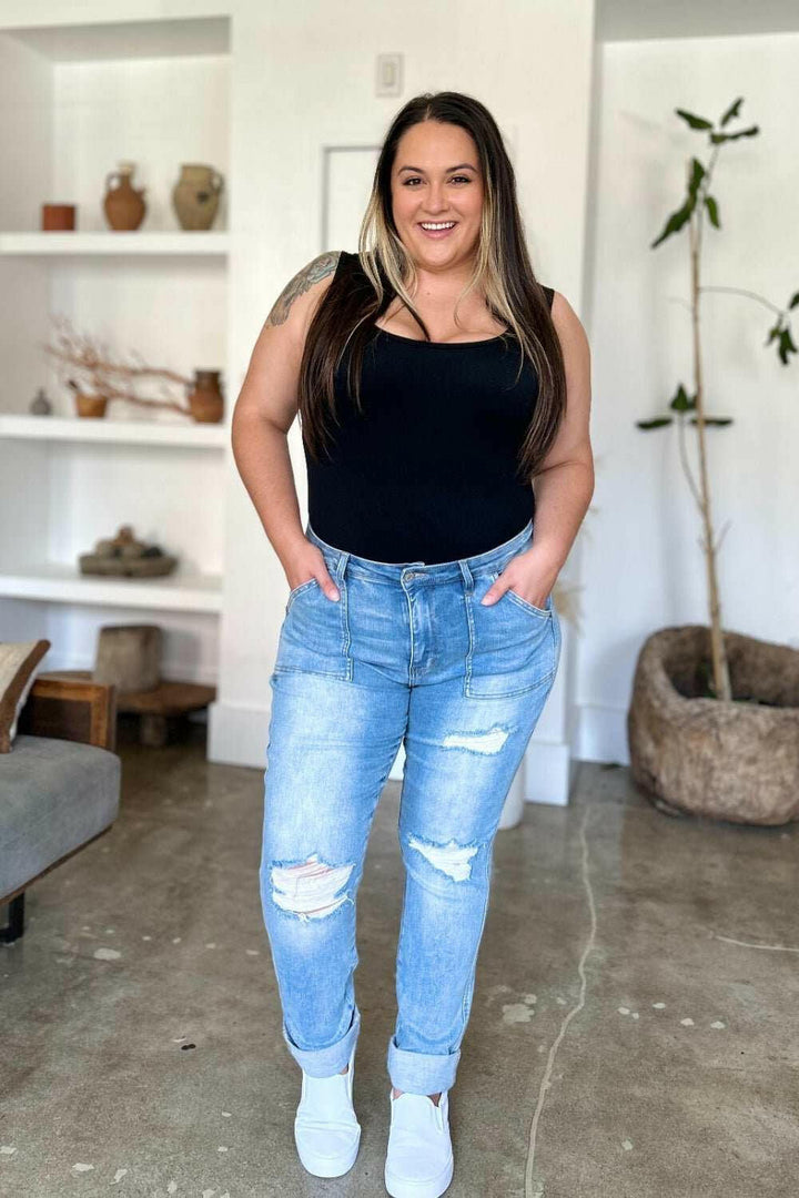 Judy Blue Distressed Straight Leg Jeans with Patch PocketsThese distressed straight jeans feature stylish patch pockets for added flair. The distressed detailing adds a trendy touch to your look. The straight cut offers a fStraight Leg JeansJudy Blue Distressed
