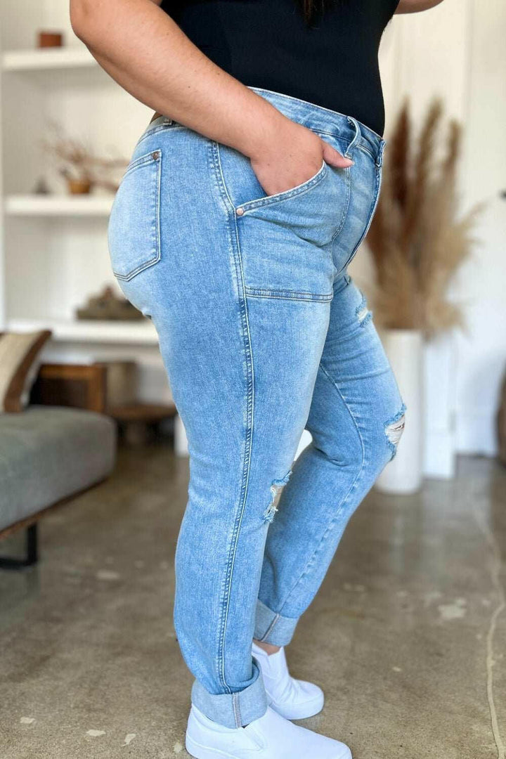 Judy Blue Distressed Straight Leg Jeans with Patch PocketsThese distressed straight jeans feature stylish patch pockets for added flair. The distressed detailing adds a trendy touch to your look. The straight cut offers a fStraight Leg JeansJudy Blue Distressed