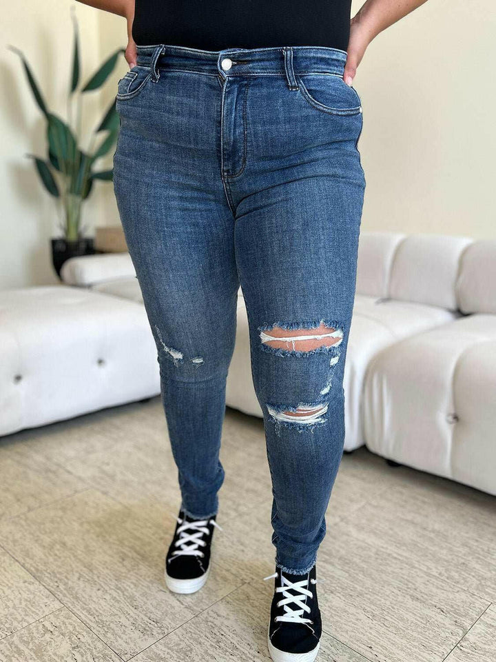 Judy Blue High Waist Distressed Skinny JeansGet the perfect fit with these versatile high waist distressed skinny jeans. Made from stretchy denim, they offer all-day comfort and a flattering silhouette. PerfecSkinny JeansJudy Blue High Waist