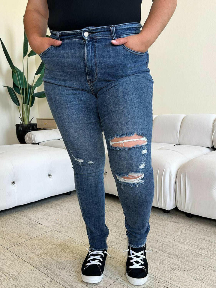 Judy Blue High Waist Distressed Skinny JeansGet the perfect fit with these versatile high waist distressed skinny jeans. Made from stretchy denim, they offer all-day comfort and a flattering silhouette. PerfecSkinny JeansJudy Blue High Waist