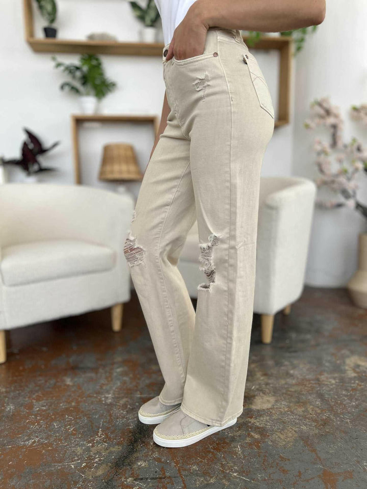 Judy Blue High Waist Distressed Wide Leg JeansStep up your denim game with our High Waist Distressed Wide Leg Jeans. These stylish and durable jeans feature a flattering and versatile wide leg silhouette and on-Wide Leg JeansJudy Blue High Waist