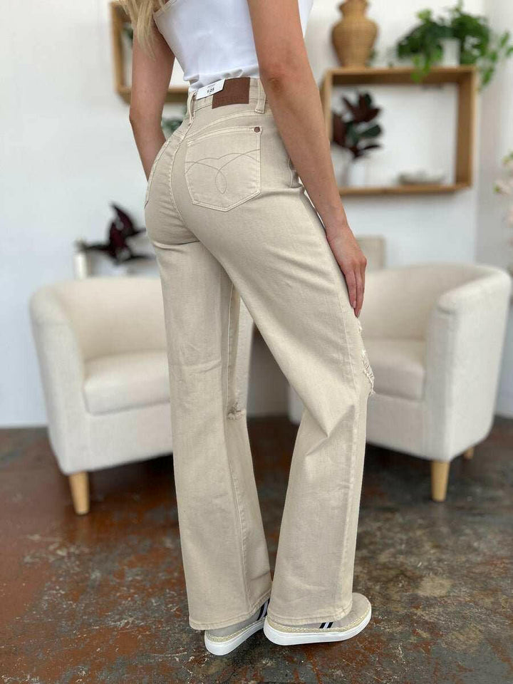 Judy Blue High Waist Distressed Wide Leg JeansStep up your denim game with our High Waist Distressed Wide Leg Jeans. These stylish and durable jeans feature a flattering and versatile wide leg silhouette and on-Wide Leg JeansJudy Blue High Waist
