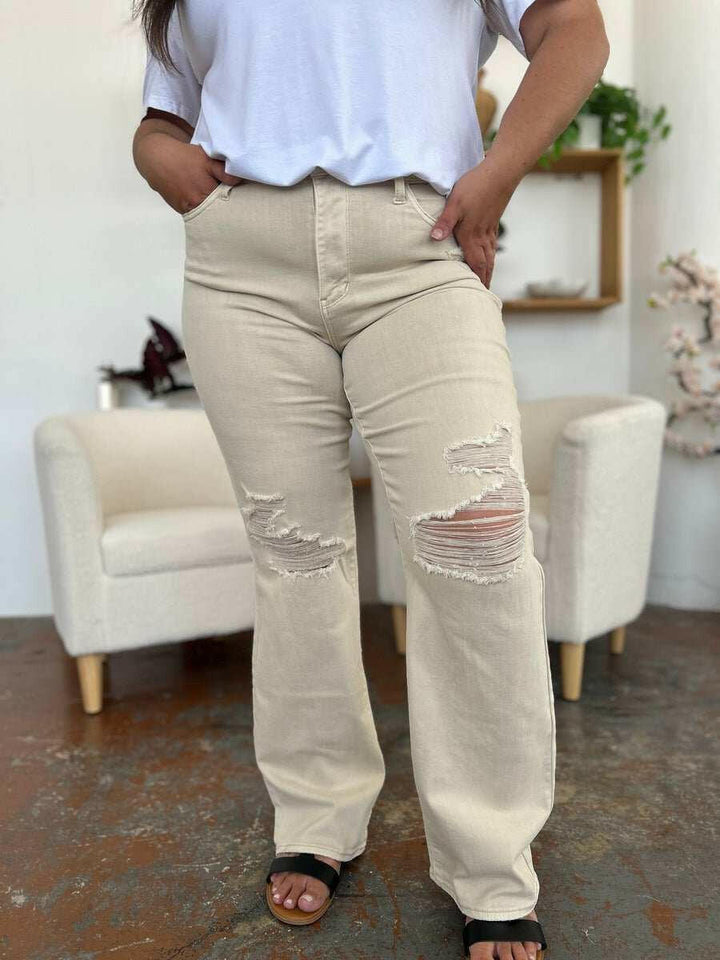 Judy Blue High Waist Distressed Wide Leg JeansStep up your denim game with our High Waist Distressed Wide Leg Jeans. These stylish and durable jeans feature a flattering and versatile wide leg silhouette and on-Wide Leg JeansJudy Blue High Waist