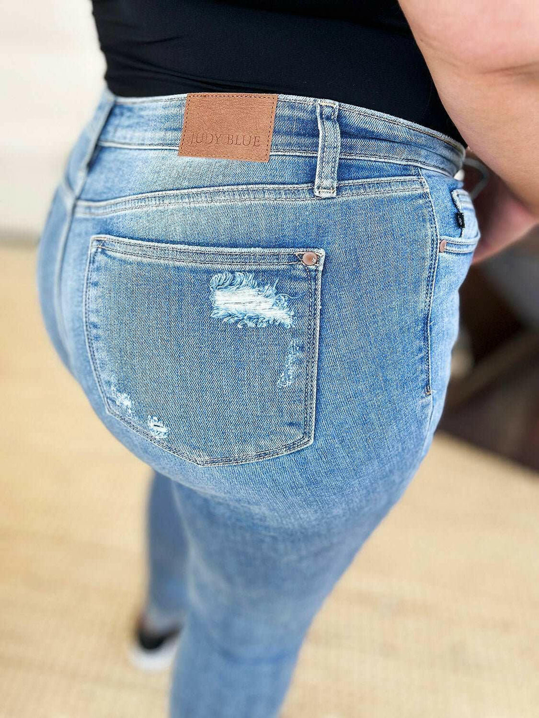 Judy Blue Mid Rise Destroy & Cuff Skinny JeansThese Judy Blue jeans are effortlessly cool, featuring a mid rise waist for a flattering silhouette and destroyed detailing for a rebellious touch. The cuffed hem adSkinny JeansJudy Blue Mid Rise
