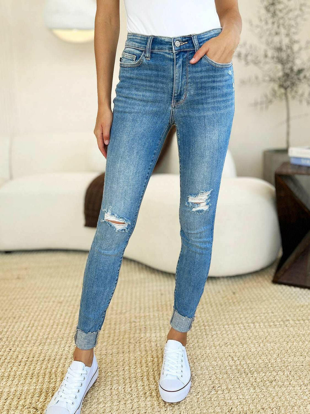 Judy Blue Mid Rise Destroy & Cuff Skinny JeansThese Judy Blue jeans are effortlessly cool, featuring a mid rise waist for a flattering silhouette and destroyed detailing for a rebellious touch. The cuffed hem adSkinny JeansJudy Blue Mid Rise