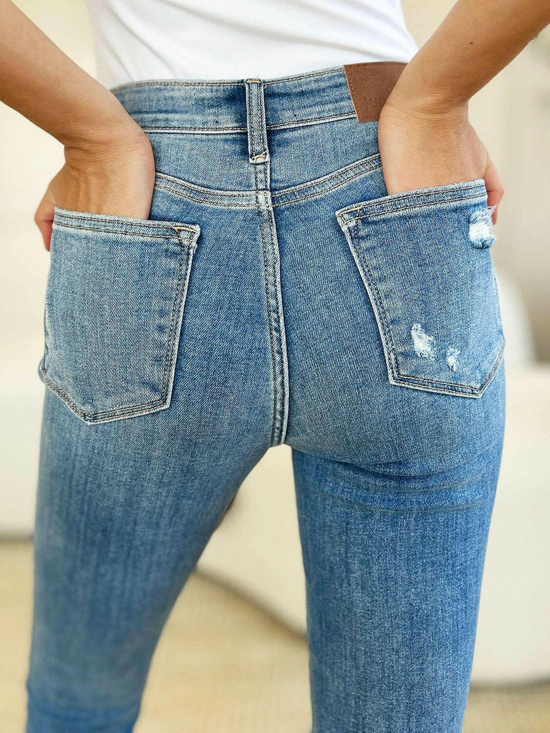 Judy Blue Mid Rise Destroy & Cuff Skinny JeansThese Judy Blue jeans are effortlessly cool, featuring a mid rise waist for a flattering silhouette and destroyed detailing for a rebellious touch. The cuffed hem adSkinny JeansJudy Blue Mid Rise