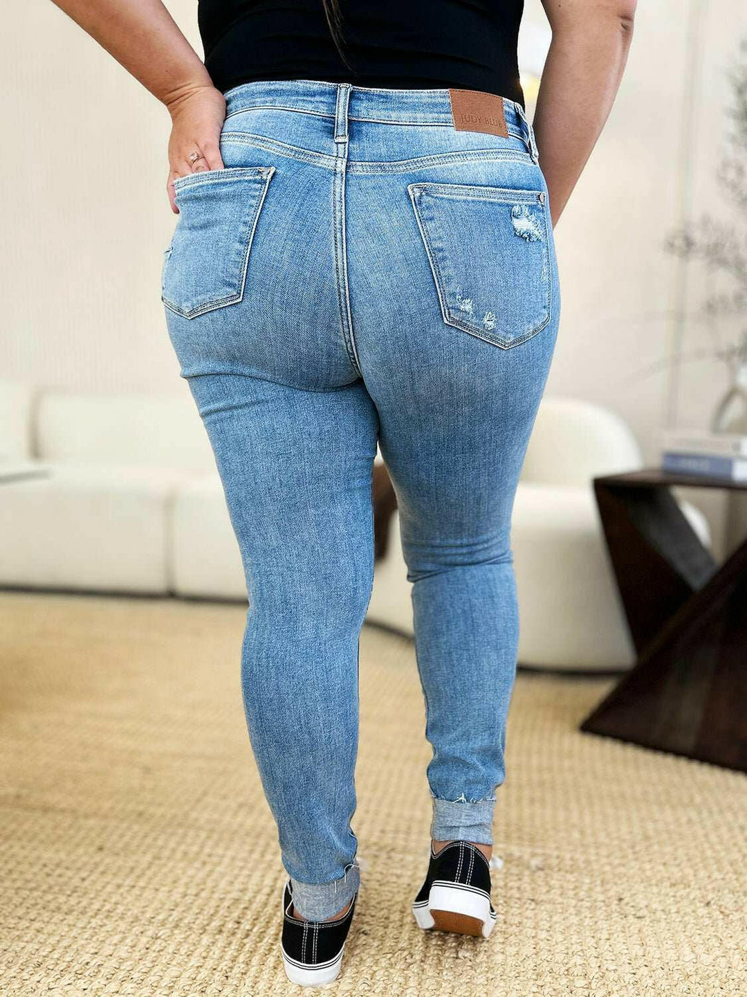 Judy Blue Mid Rise Destroy & Cuff Skinny JeansThese Judy Blue jeans are effortlessly cool, featuring a mid rise waist for a flattering silhouette and destroyed detailing for a rebellious touch. The cuffed hem adSkinny JeansJudy Blue Mid Rise