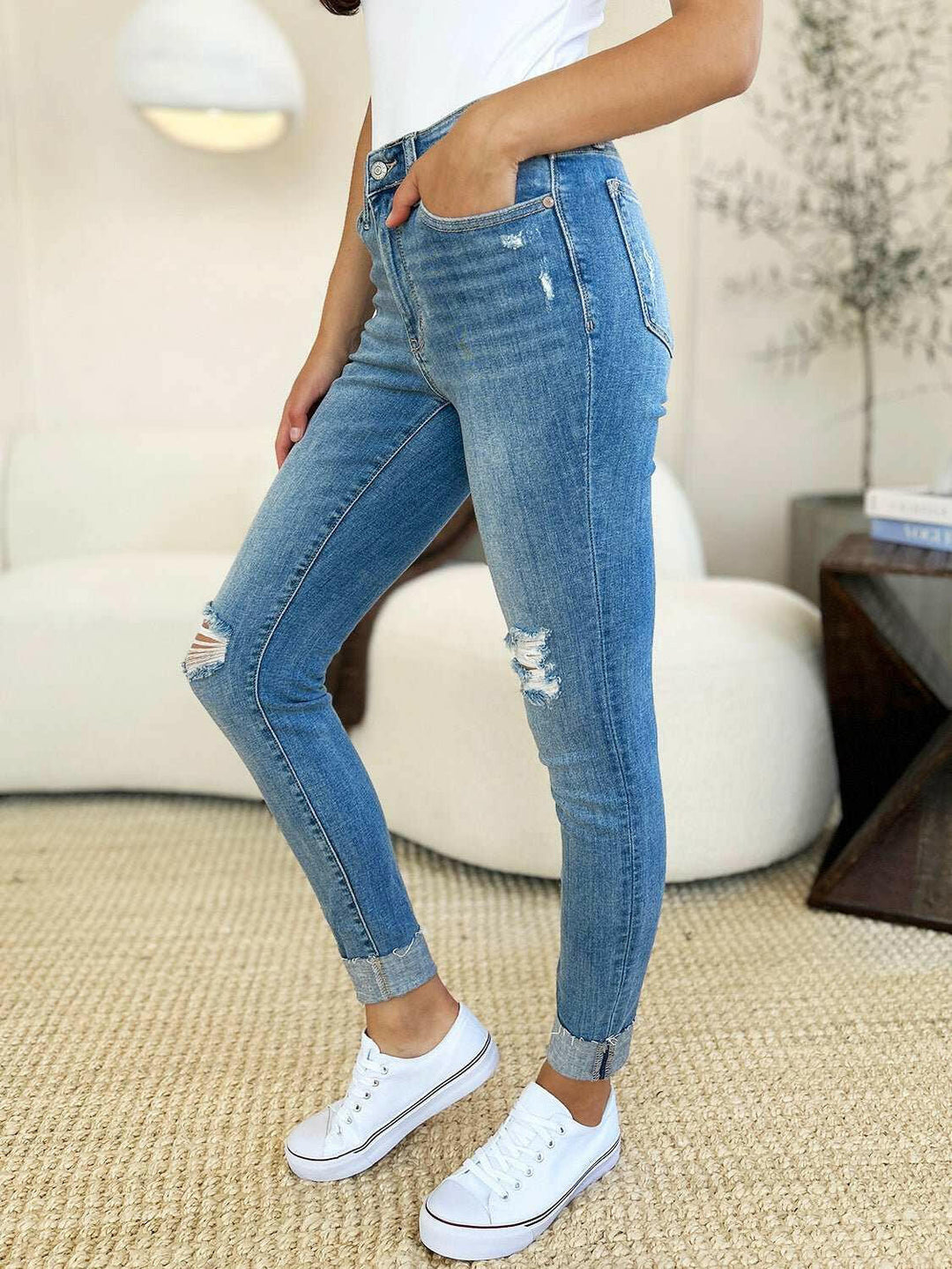 Judy Blue Mid Rise Destroy & Cuff Skinny JeansThese Judy Blue jeans are effortlessly cool, featuring a mid rise waist for a flattering silhouette and destroyed detailing for a rebellious touch. The cuffed hem adSkinny JeansJudy Blue Mid Rise
