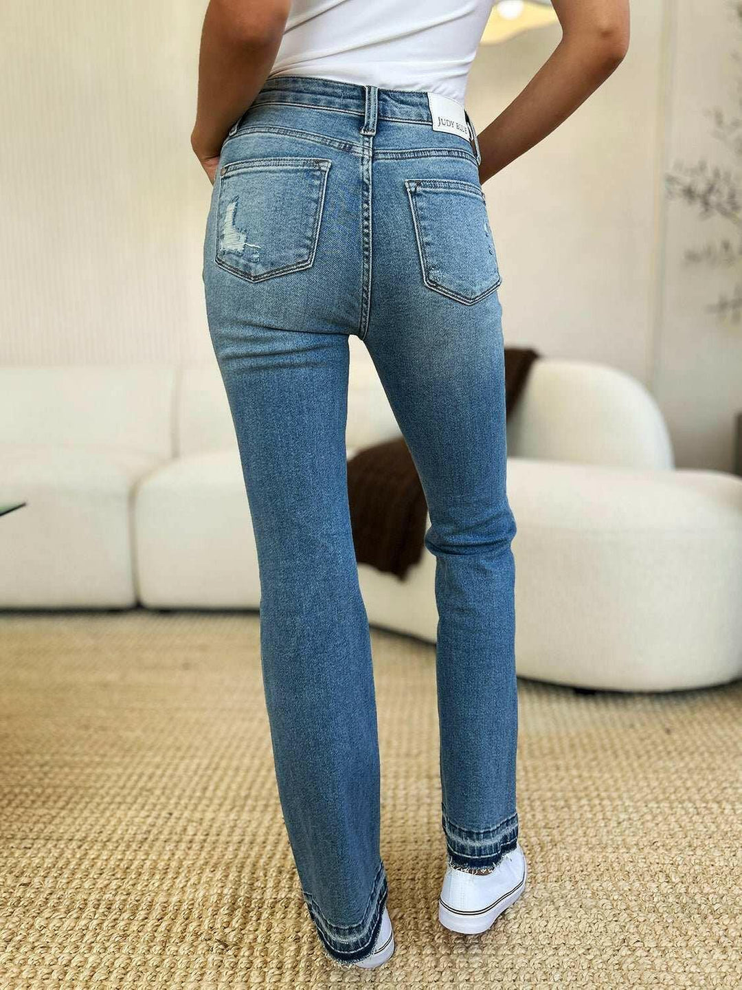 Judy Blue Mid Rise Destroyed Hem Distressed JeansExperience unparalleled style with the Judy Blue Mid Rise Destroyed Hem Distressed Jeans, designed exclusively for those who dare to stand out. These flare jeans empFlare JeansJudy Blue Mid Rise