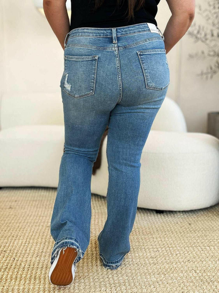 Judy Blue Mid Rise Destroyed Hem Distressed JeansExperience unparalleled style with the Judy Blue Mid Rise Destroyed Hem Distressed Jeans, designed exclusively for those who dare to stand out. These flare jeans empFlare JeansJudy Blue Mid Rise