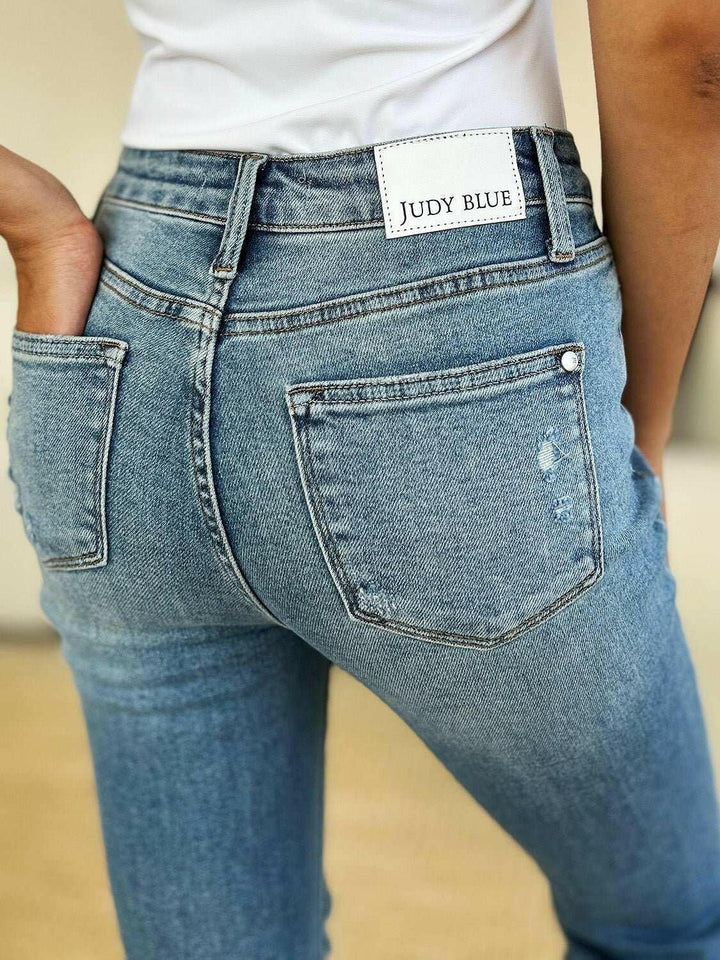 Judy Blue Mid Rise Destroyed Hem Distressed JeansExperience unparalleled style with the Judy Blue Mid Rise Destroyed Hem Distressed Jeans, designed exclusively for those who dare to stand out. These flare jeans empFlare JeansJudy Blue Mid Rise