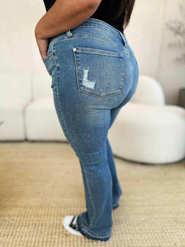 Judy Blue Mid Rise Destroyed Hem Distressed JeansExperience unparalleled style with the Judy Blue Mid Rise Destroyed Hem Distressed Jeans, designed exclusively for those who dare to stand out. These flare jeans empFlare JeansJudy Blue Mid Rise