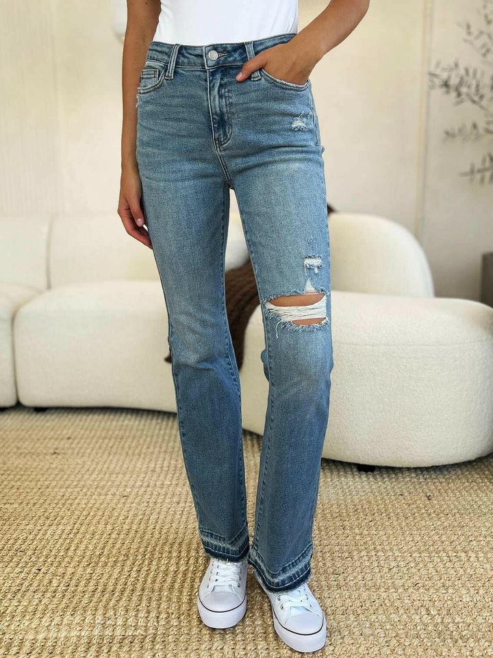 Judy Blue Mid Rise Destroyed Hem Distressed JeansExperience unparalleled style with the Judy Blue Mid Rise Destroyed Hem Distressed Jeans, designed exclusively for those who dare to stand out. These flare jeans empFlare JeansJudy Blue Mid Rise