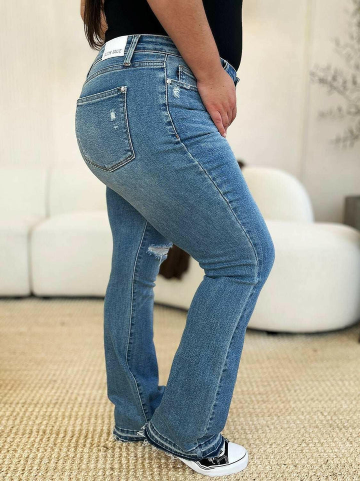 Judy Blue Mid Rise Destroyed Hem Distressed JeansExperience unparalleled style with the Judy Blue Mid Rise Destroyed Hem Distressed Jeans, designed exclusively for those who dare to stand out. These flare jeans empFlare JeansJudy Blue Mid Rise