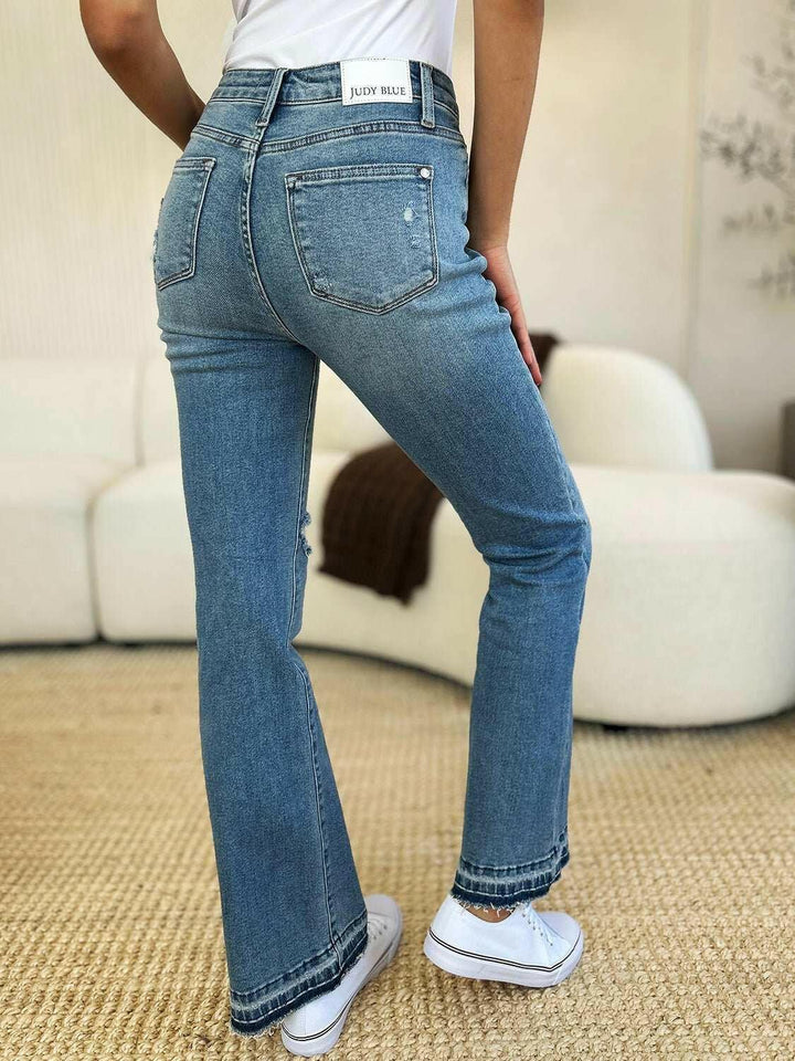 Judy Blue Mid Rise Destroyed Hem Distressed JeansExperience unparalleled style with the Judy Blue Mid Rise Destroyed Hem Distressed Jeans, designed exclusively for those who dare to stand out. These flare jeans empFlare JeansJudy Blue Mid Rise