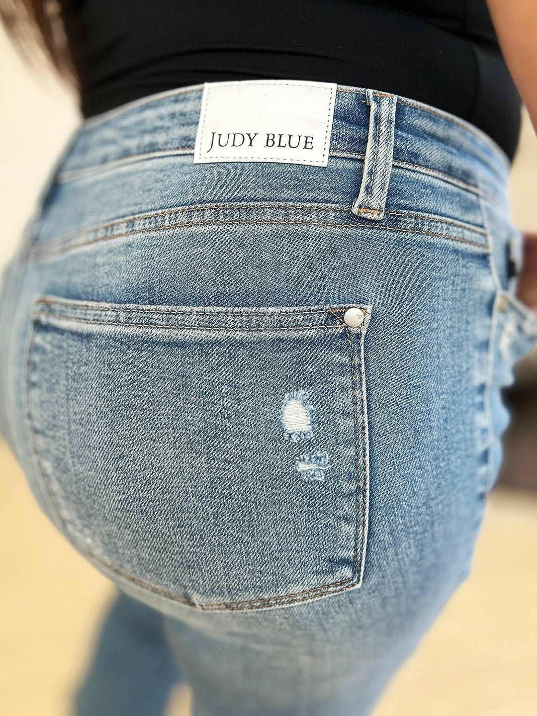 Judy Blue Mid Rise Destroyed Hem Distressed JeansExperience unparalleled style with the Judy Blue Mid Rise Destroyed Hem Distressed Jeans, designed exclusively for those who dare to stand out. These flare jeans empFlare JeansJudy Blue Mid Rise