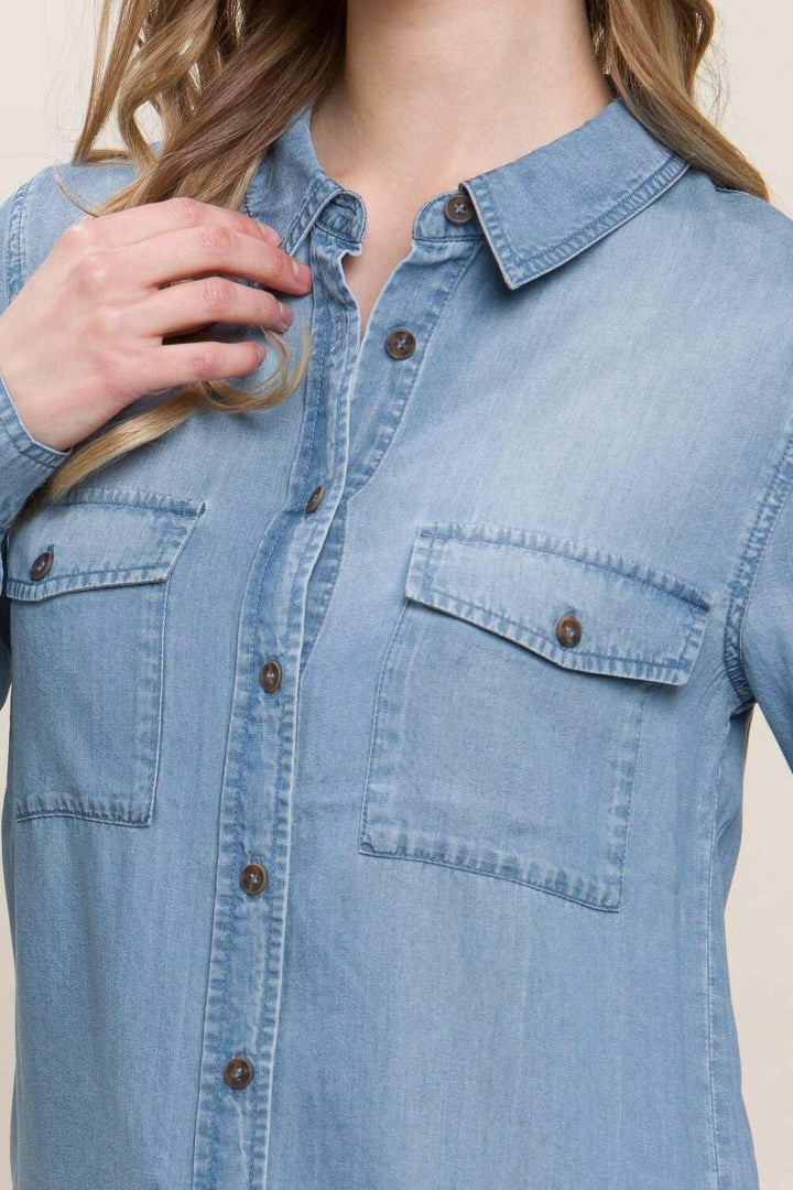Button Up Denim ShirtThis versatile Scooped Hem Button Up Shirt is the stylish addition your wardrobe. Its modern scooped hem adds a flattering touch to the classic button-up style. WhetButton-Up ShirtsButton Up Denim Shirt