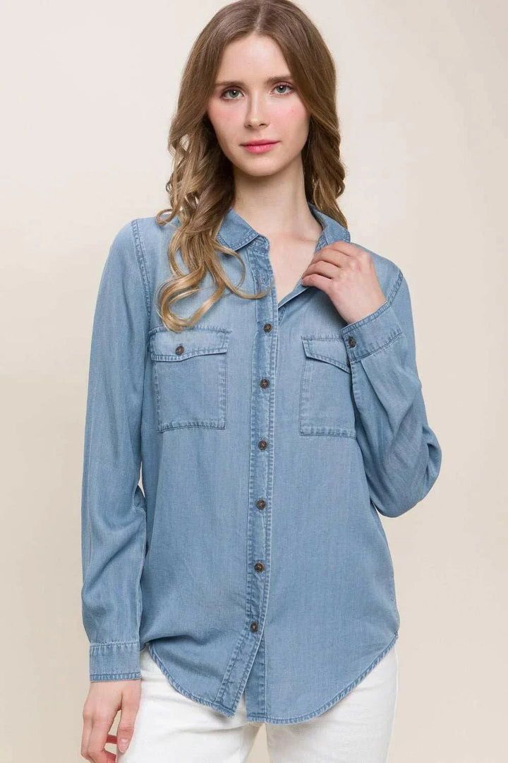 Button Up Denim ShirtThis versatile Scooped Hem Button Up Shirt is the stylish addition your wardrobe. Its modern scooped hem adds a flattering touch to the classic button-up style. WhetButton-Up ShirtsButton Up Denim Shirt