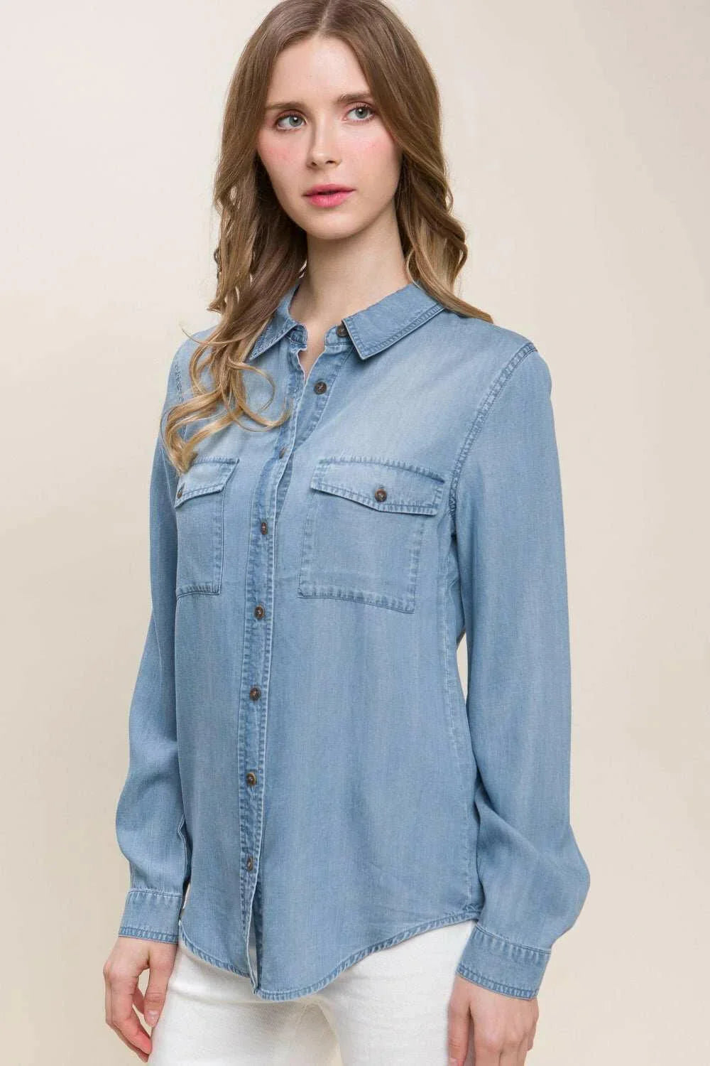 Button Up Denim ShirtThis versatile Scooped Hem Button Up Shirt is the stylish addition your wardrobe. Its modern scooped hem adds a flattering touch to the classic button-up style. WhetButton-Up ShirtsButton Up Denim Shirt